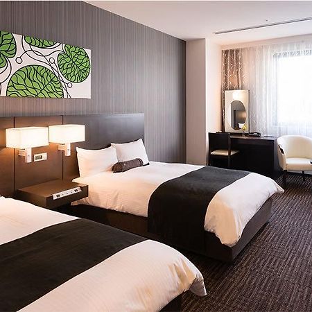 Osaka Airterminal Hotel Тоёнака Экстерьер фото